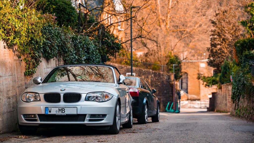 A BMW sports car parked on a picturesque street in Heidelberg, Germany.