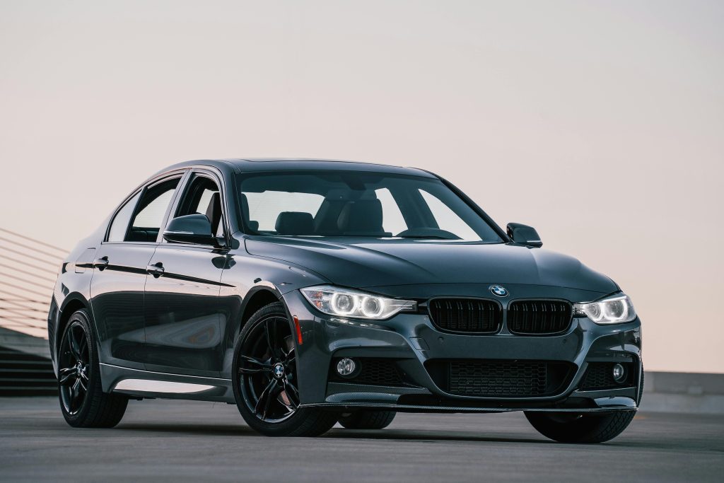 Stylish black sedan captured outdoors at sunset with a sleek design and modern appeal.